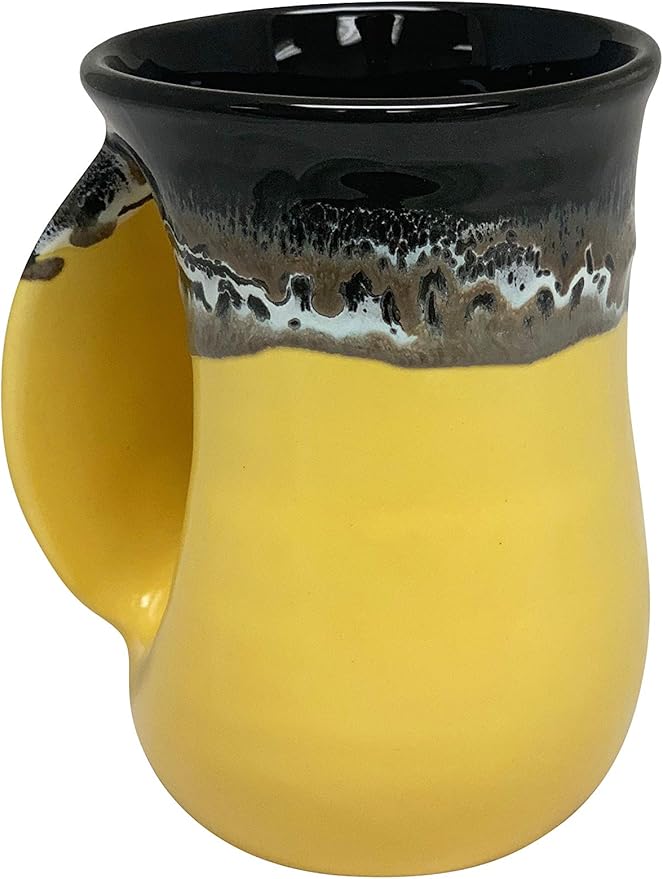 Clay in Motion Hand Warmer Coffee Mug – Handmade Coffee Mug With Comfortable Handle Contoured Pocket Hand Warming Ceramic Coffee Mug – Proudly Made in USA – Left Handed – 14 Oz - Yellow Black